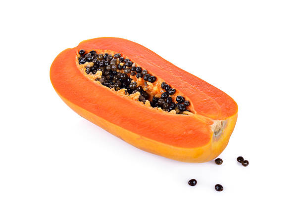 istock half cut ripe papaya with seed on white background 623374376