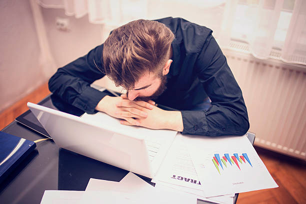istock Depressive businessman in office 623374590