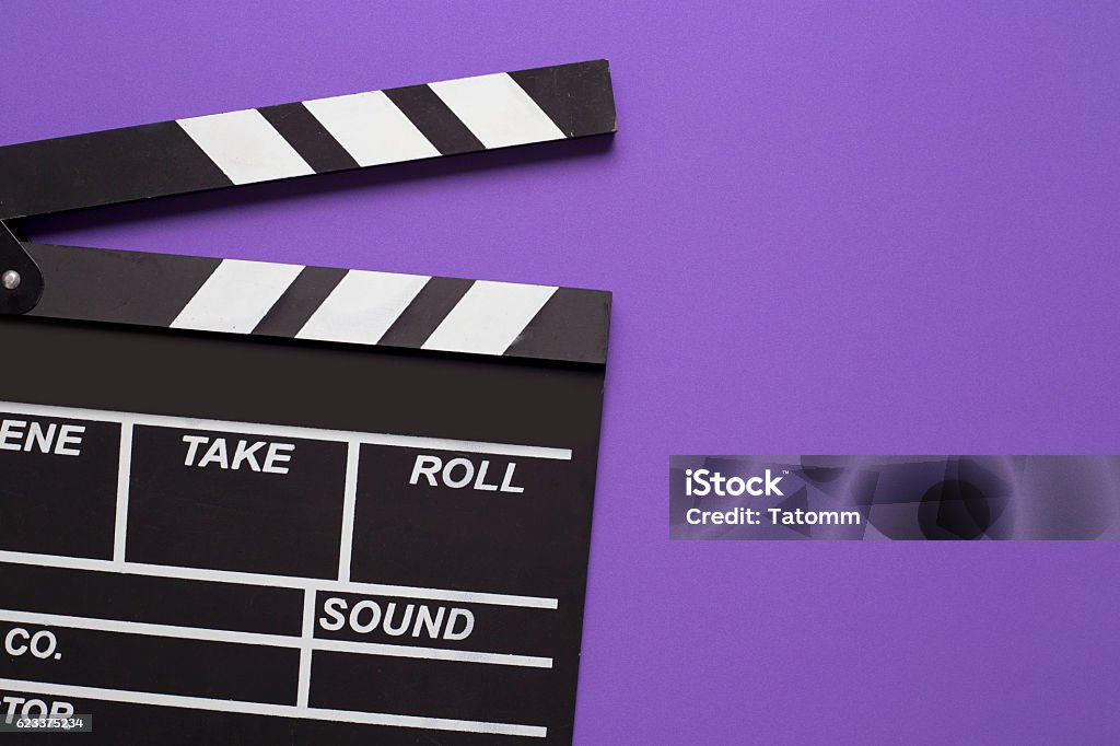 movie clapper on violet background Movie Stock Photo