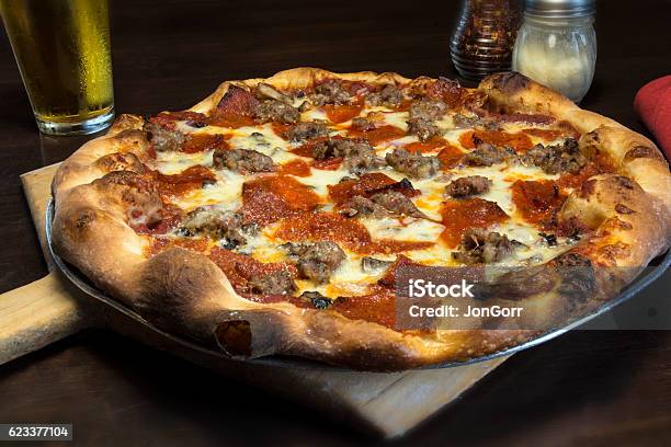 Gourmet Italian Pepperoni Pizza In Restaurant Setting Stock Photo - Download Image Now