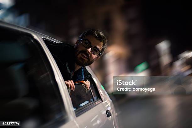 Bearded Man Enjoying In Car In Urban Scene Stock Photo - Download Image Now - Addiction, Adolescence, Adult