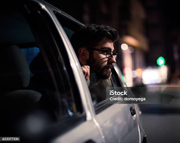 Bearded Man Enjoying In Car In Urban Scene Stock Photo - Download Image Now - Addiction, Adolescence, Adult