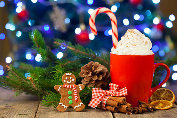 istock Christmas cappuccino and gingerbread cookies infront Christmas tree 623378026