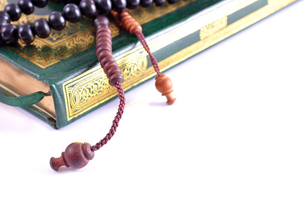 istock The Holy Quran with prayer beads 623378046