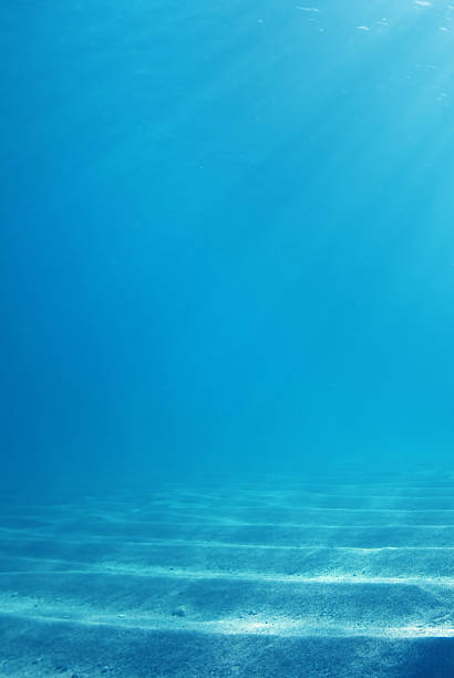 istock Sunbeams in deep blue water travel concept 623379538