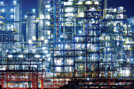 Close-up refinery & chemical plant at night. 