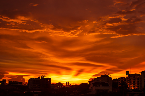 Seattle, USA - May 15, 2023: Late in the day a vivid sunset over pier 56 and the city.