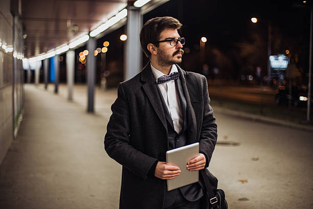 istock Young business man holding tablet and walking 623383718
