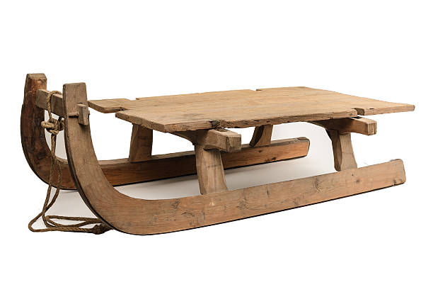 Old wooden sledge isolated on white background