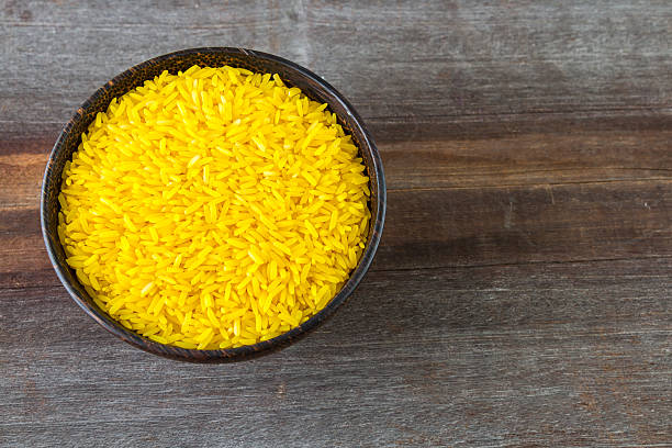 istock Color rice in bowl on wood background 623420716
