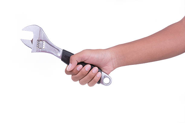 istock Hand hold fix wrench on white background 623420870