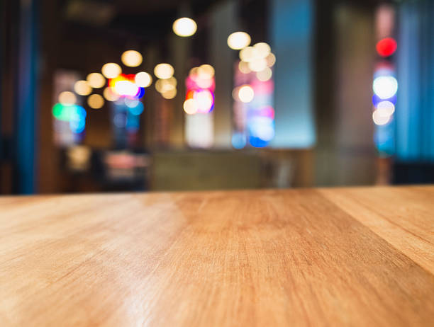 istock Table top Colourful light Blurred Bar restaurant cafe interior background 623421872