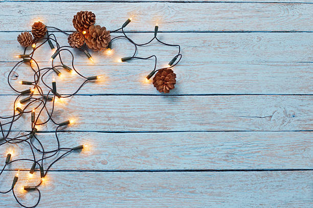 istock christmas lights on blue wooden background 623422388