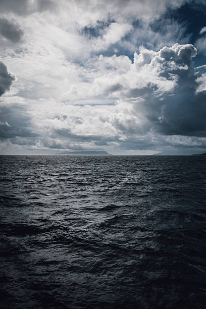 istock Dramatic sky breaking over the Isle of Rum and ocean 623423366