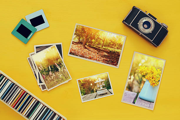 istock Top view of photographs next to old camera 623423634