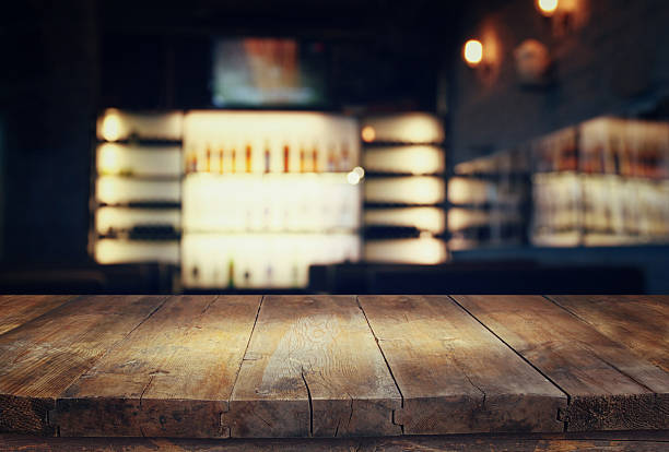 istock table in front of abstract blurred restaurant lights 623423922