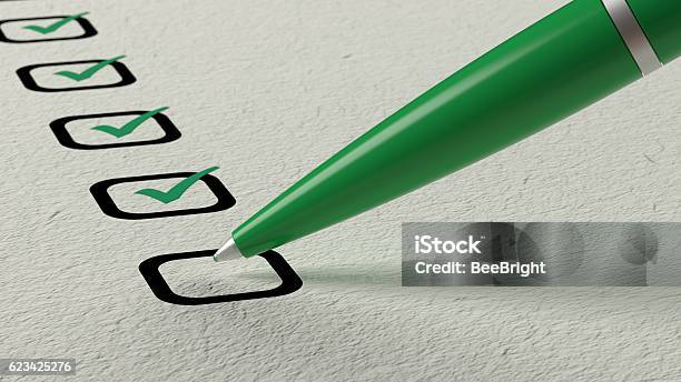 Green Ball Pen Crossing Off Items From A Checklist Stock Photo - Download Image Now - Checklist, Check Mark, Checked Pattern