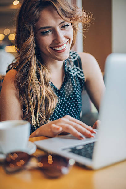 istock Girl typing on a laptop in cafe 623427030