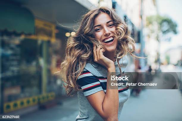 Turning Around To Look Back Stock Photo - Download Image Now - Teenage Girls, Smiling, Beautiful People