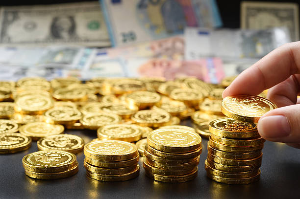 istock hand deliver a stack of coins in the form of graph 623428118