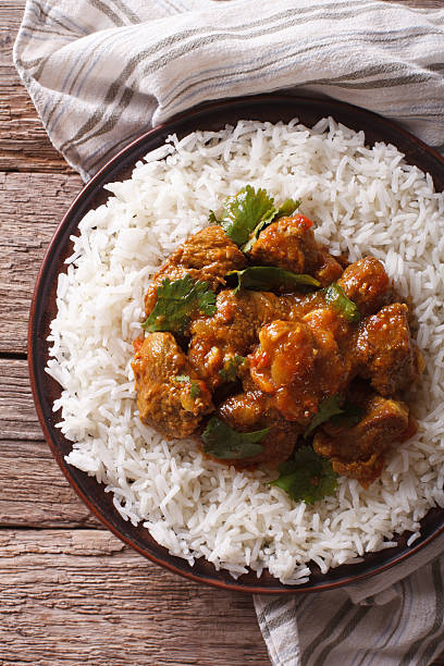 istock Indian Madras beef with basmati rice closeup. vertical top view 623428618