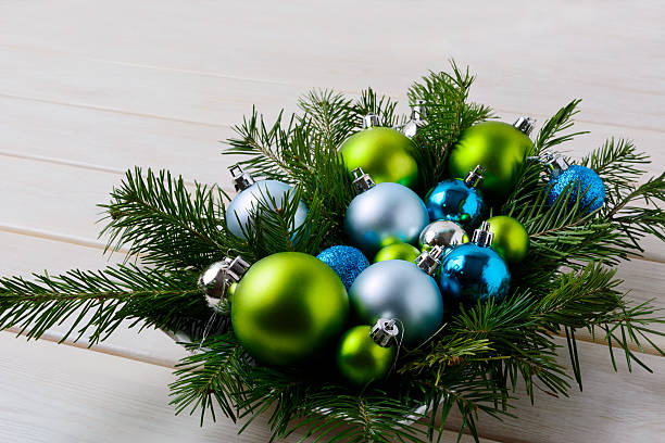 istock Christmas table centerpiece with silver, blue and green ornament 623430384