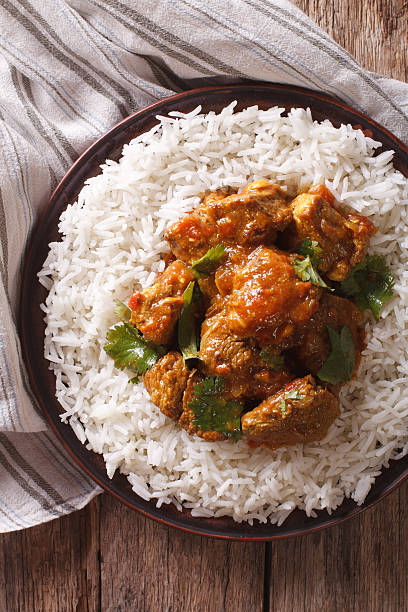 istock beef madras with basmati rice close-up on a plate. vertical 623430730