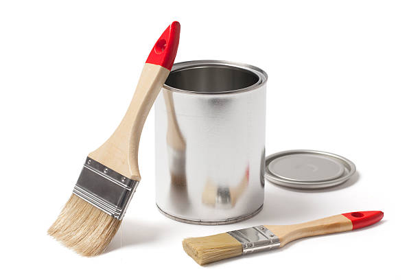 Open Metal Paint Can with New Brushes stock photo