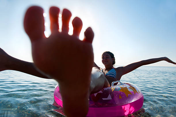 istock Unforgetable summertime holidays! Swimming on iflatable ring. 623434154