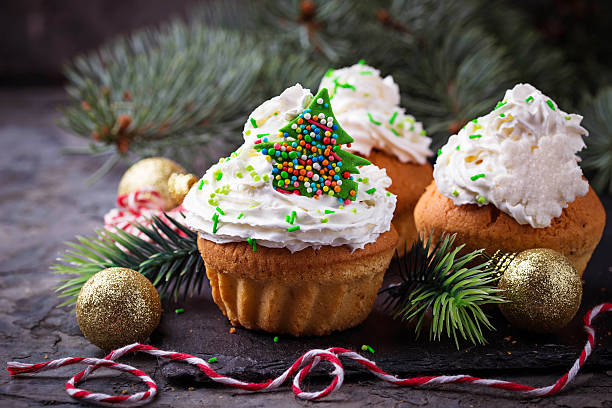 istock Christmas cupcakes with whipped cream 623434452