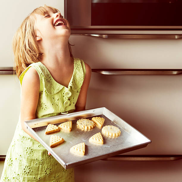 istock Kid Baking Cooking Cookies Fun Concept 623435444