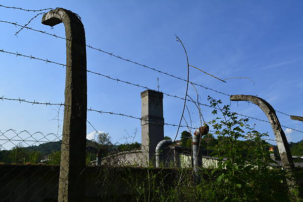 istock closed factory, barbed wire 623435914