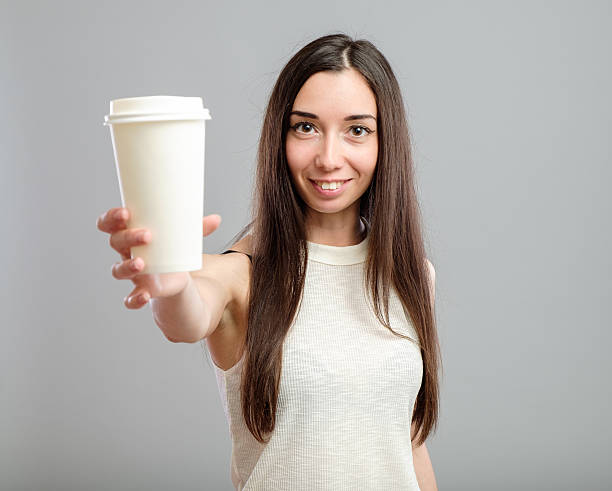 istock Woman offering white cup of coffee 623437306