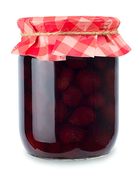 istock strawberry jam in jar isolated on white 623437916