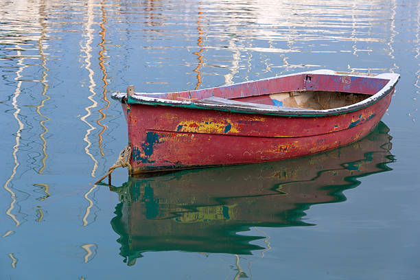 istock old boat with different old color in harbor 623438842