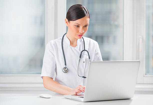 istock Portrait of a female doctor using laptop computer 623441094