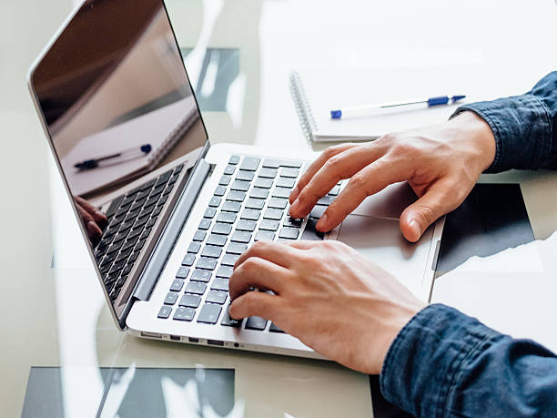 istock Businessmen's hands typing on laptop 623441416