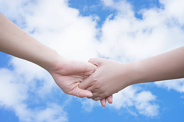 istock woman and man touch each other on sky background 623444262