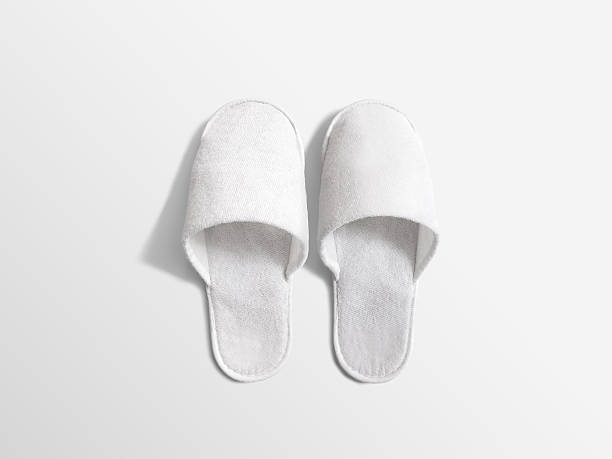 Pair of blank soft white home slippers, design mockup Pair of blank soft white home slippers, design mockup. House plain flops mock up template top view. Clear warm domestic sandal. Bed shoes accessory footwear. slipper stock pictures, royalty-free photos & images