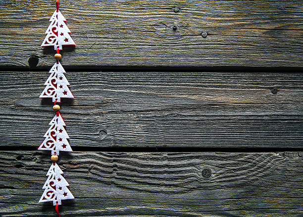 istock Wooden carved christmas tree on background 623444780
