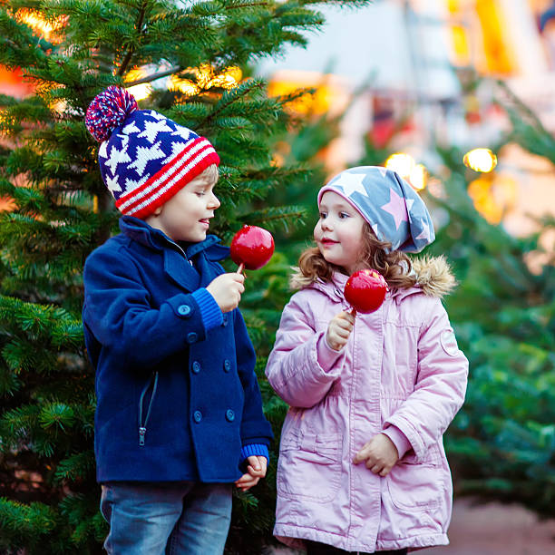 istock Two little kids hugging on Christmas market 623445066
