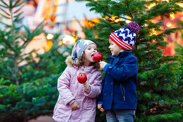 istock Two little kids hugging on Christmas market 623445454