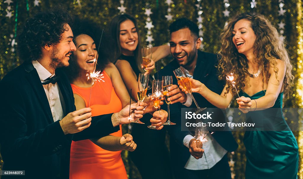 New Year's Eve Toast Happy friends celebrating the New Year. Party - Social Event Stock Photo