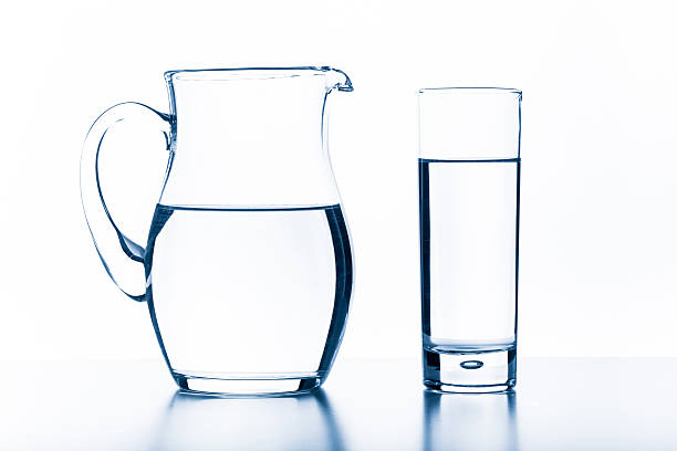istock jug and glass on a white background 623449578