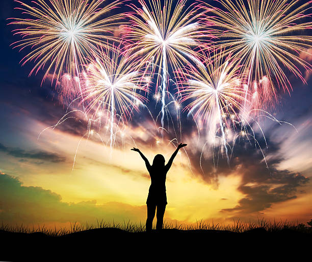 istock Woman watching beautiful fireworks holiday. 623449954