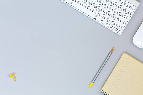 istock Top view of flat Lay office workplace on grey Table 623450190