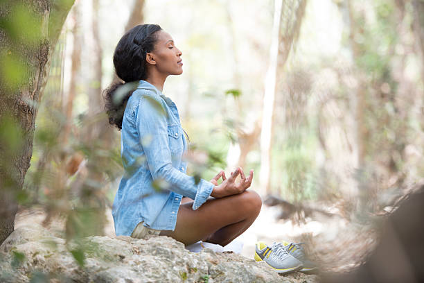 istock Woman meditating outdoors. 623450236