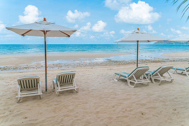 istock Beautiful beach chairs on tropical white sand beach 623452784