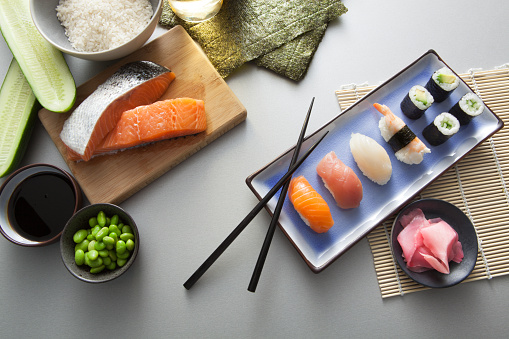 Sushi closeup isolated on white background. Sushi with algae nori rice salmon and chuka.