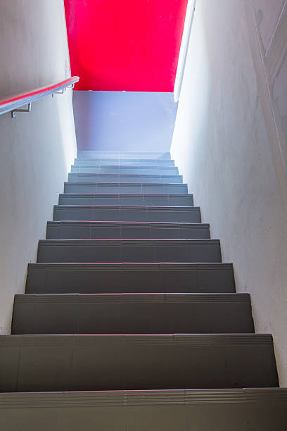 istock Stairs steps with red background - construction detail. 623455670